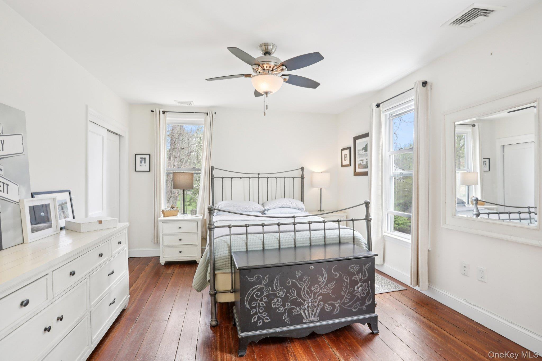 101 Spring Valley Road Ossining, NY 10562 - Photo 29 of 39 a bedroom with a bed and wooden floor