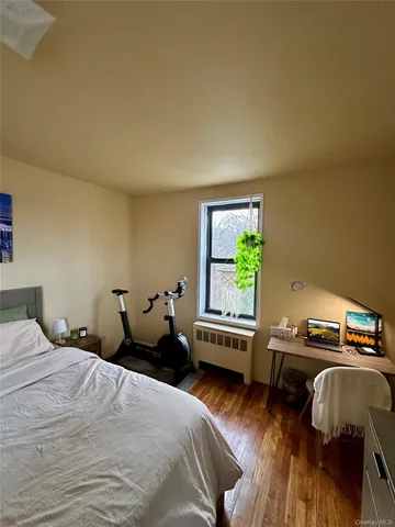 a bedroom with a bed and a chair