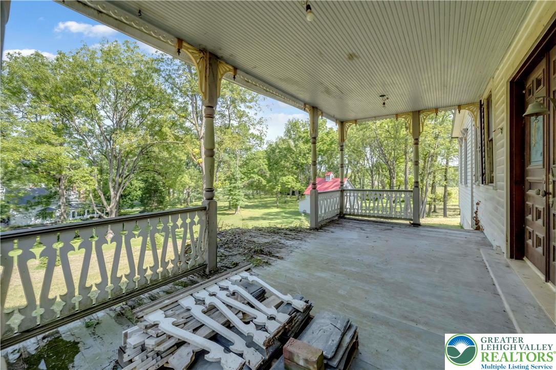 384 Henry Road Nazareth, PA 18064 - Photo 50 of 54 Historic details highlight this wide covered porch overlooking a spacious yard.