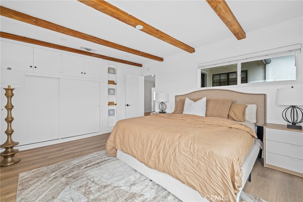 3045 Scott Road Burbank, CA 91504 - Photo 15 of 39 a spacious bedroom with a bed and a dresser