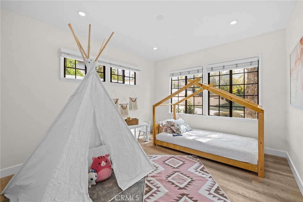 3045 Scott Road Burbank, CA 91504 - Photo 21 of 39 a living room with a couch and a rug