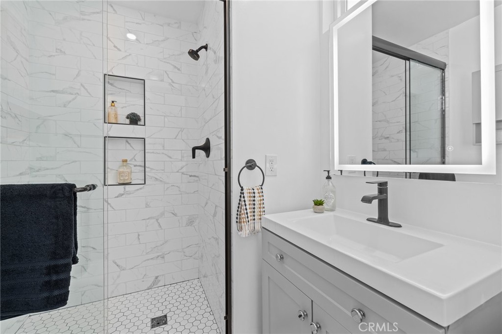 3045 Scott Road Burbank, CA 91504 - Photo 26 of 39 a bathroom with a sink and a mirror
