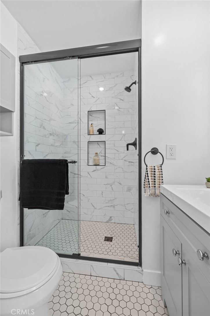 3045 Scott Road Burbank, CA 91504 - Photo 27 of 39 a bathroom with a toilet a sink and shower