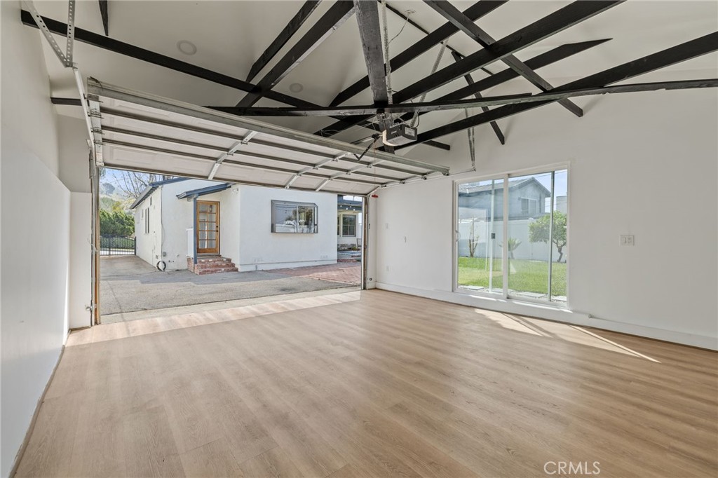 3045 Scott Road Burbank, CA 91504 - Photo 35 of 39 an empty room with wooden floor and windows