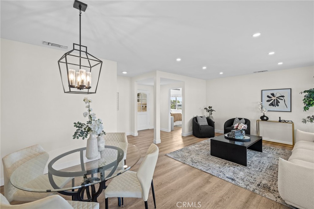 3045 Scott Road Burbank, CA 91504 - Photo 7 of 39 a living room with furniture a window and a chandelier