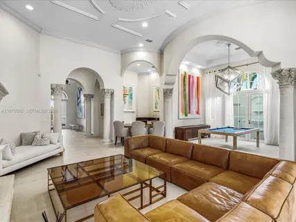 a living room with furniture kitchen view and a dining table