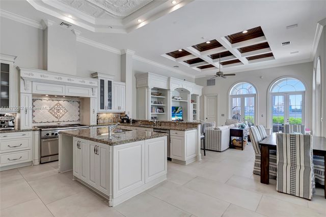 a kitchen with stainless steel appliances granite countertop a sink and cabinets