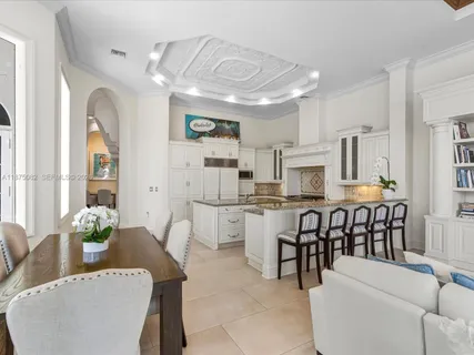 a kitchen with a sink cabinets and appliances