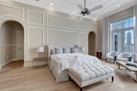 a spacious bathroom with a granite countertop sink mirror and bathtub