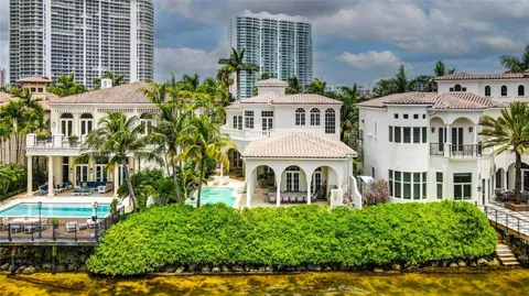 a front view of a residential apartment building with a yard