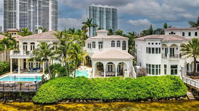 a front view of a residential apartment building with a yard