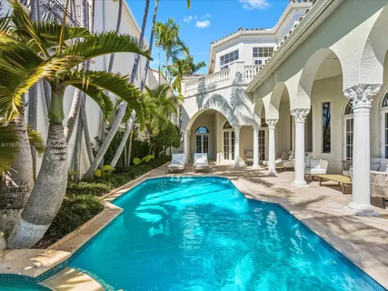a view of yard with swimming pool and furniture