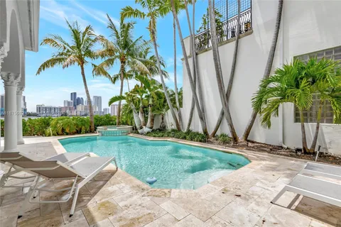 an aerial view of a house with a yard and garden