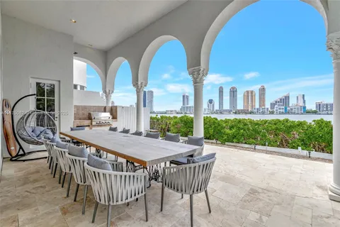 an aerial view of a house with a lake house swimming pool and outdoor space