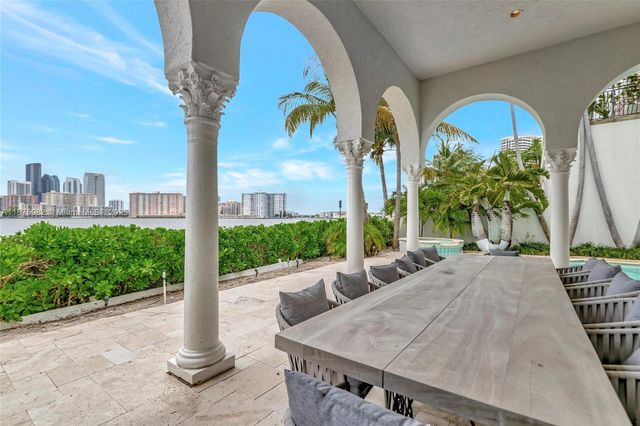 a front view of multiple houses with yard