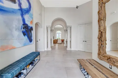 a view of a livingroom with furniture and bathroom