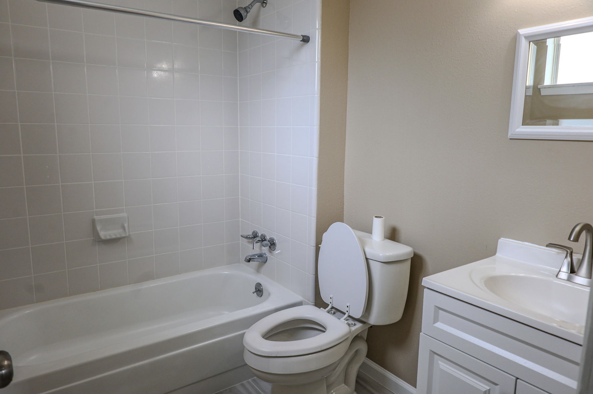 722 Canna Street Channelview, TX 77530 - Photo 7 of 10 a white toilet sitting next to a bath tub
