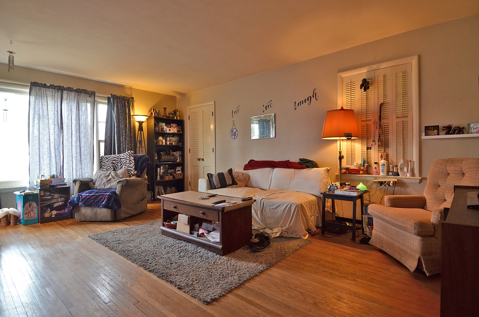 772 Adams Street Ottawa, IL 61350 - Photo 2 of 15 a bed room with bed and a couch