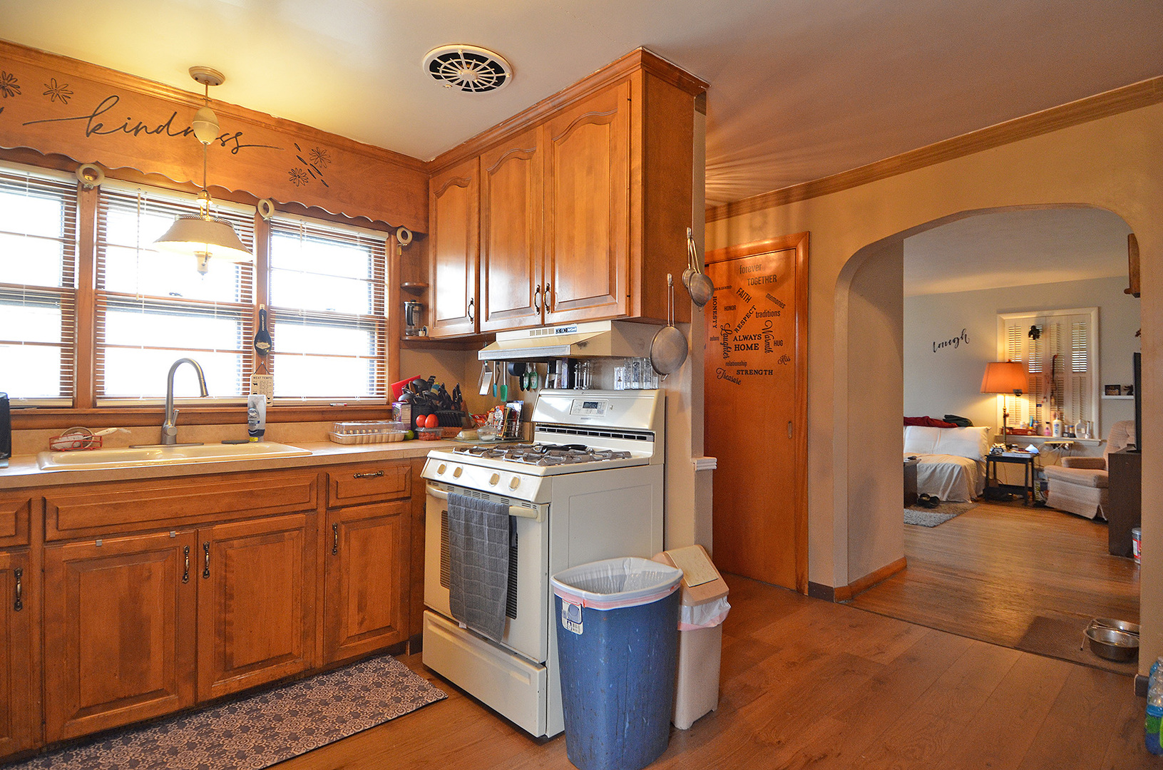 772 Adams Street Ottawa, IL 61350 - Photo 7 of 15 a kitchen with a sink stove and cabinets