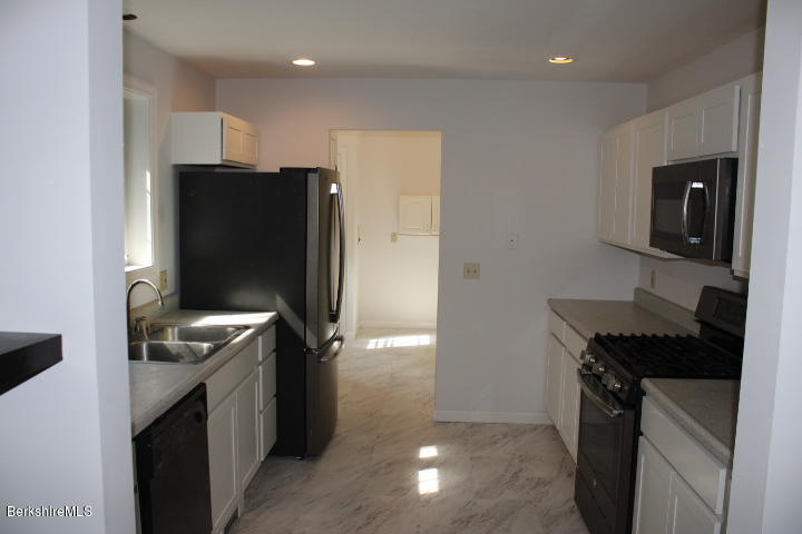 399 River Road Windsor, MA 01270 - Photo 2 of 19 a kitchen with stainless steel appliances granite countertop a refrigerator and a stove