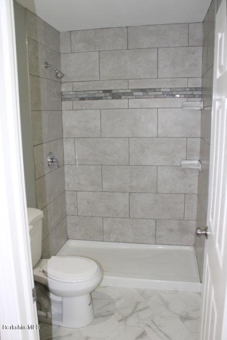 399 River Road Windsor, MA 01270 - Photo 14 of 19 a bathroom with a shower and a toilet