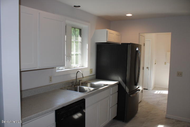 399 River Road Windsor, MA 01270 - Photo 3 of 19 a kitchen with a sink and refrigerator
