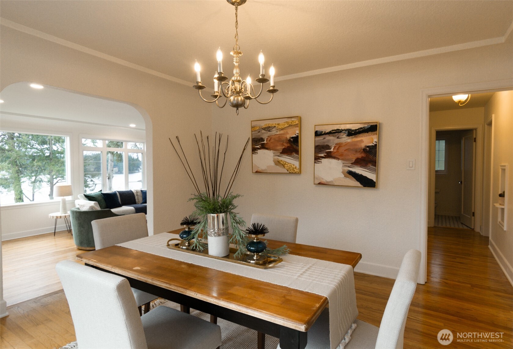 10826 Meadow Road Southwest Lakewood, WA 98499 - Photo 11 of 40 a view of a dining room with furniture wooden floor and chandelier