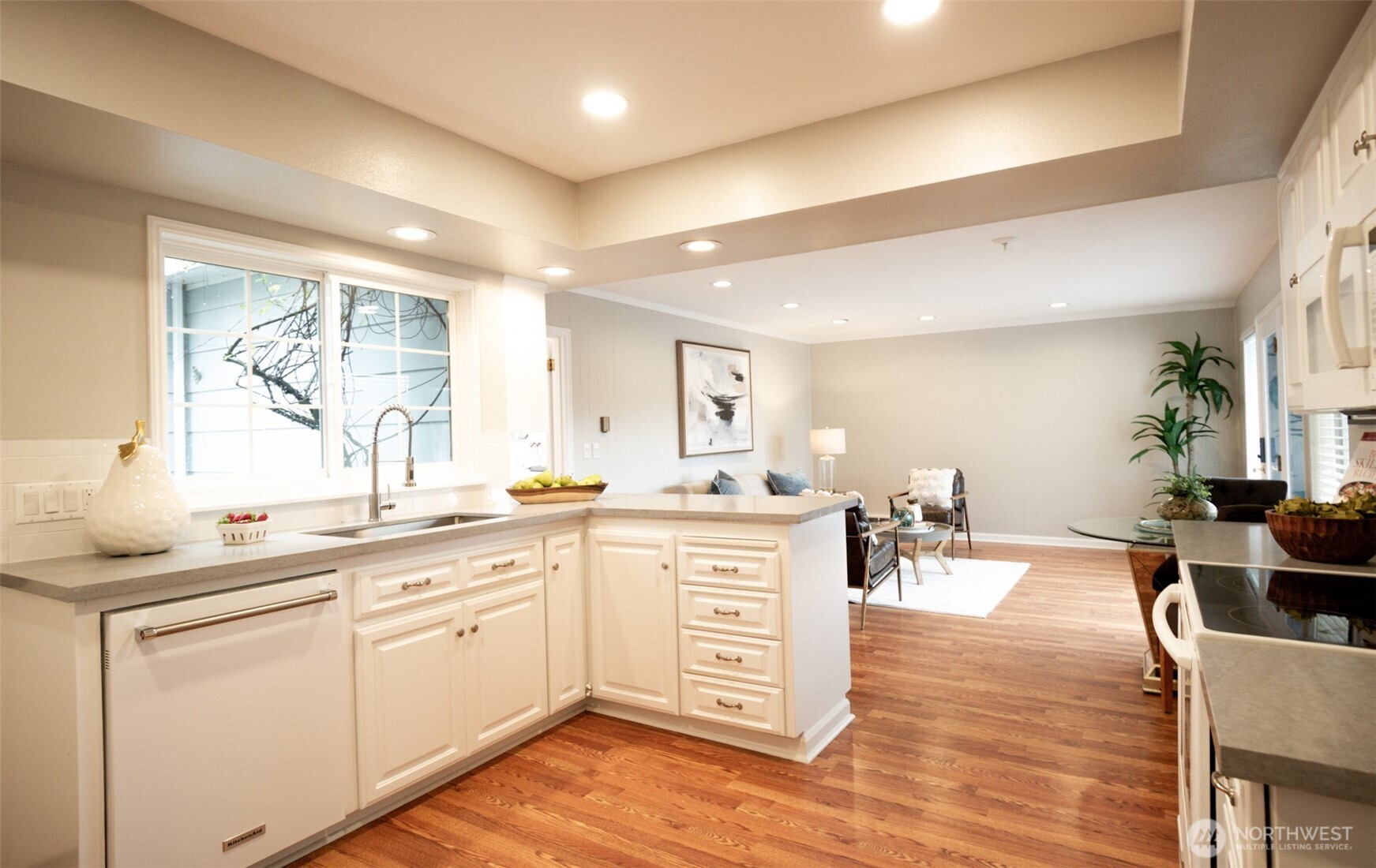 10826 Meadow Road Southwest Lakewood, WA 98499 - Photo 13 of 40 a kitchen with lots of counter top space and dining table
