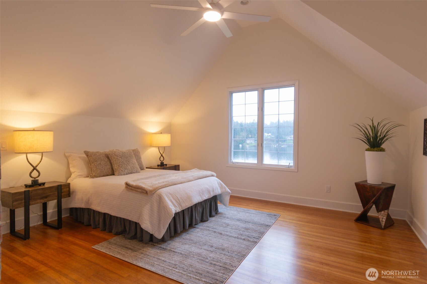 10826 Meadow Road Southwest Lakewood, WA 98499 - Photo 18 of 40 a bedroom with a bed and a potted plant