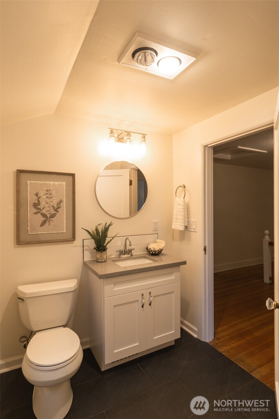 10826 Meadow Road Southwest Lakewood, WA 98499 - Photo 21 of 40 a bathroom with a toilet a sink and mirror