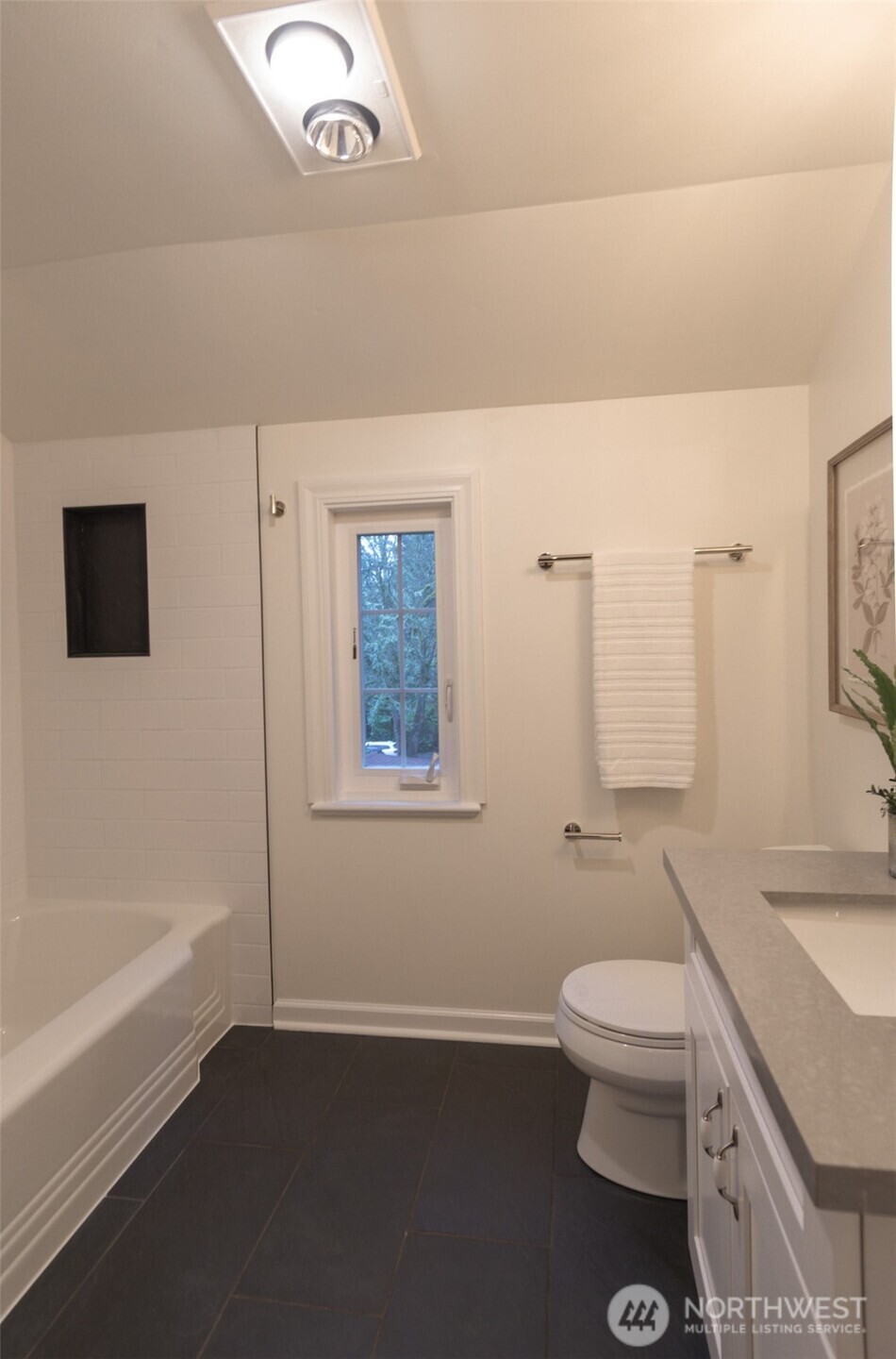 10826 Meadow Road Southwest Lakewood, WA 98499 - Photo 22 of 40 a bathroom with a granite countertop toilet a sink and bathtub