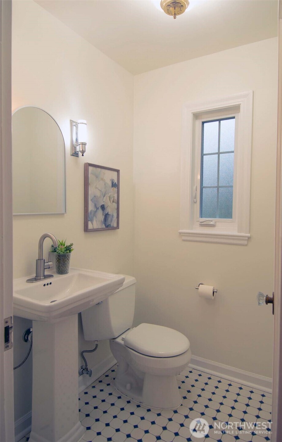 10826 Meadow Road Southwest Lakewood, WA 98499 - Photo 24 of 40 a bathroom with a sink a toilet and mirror