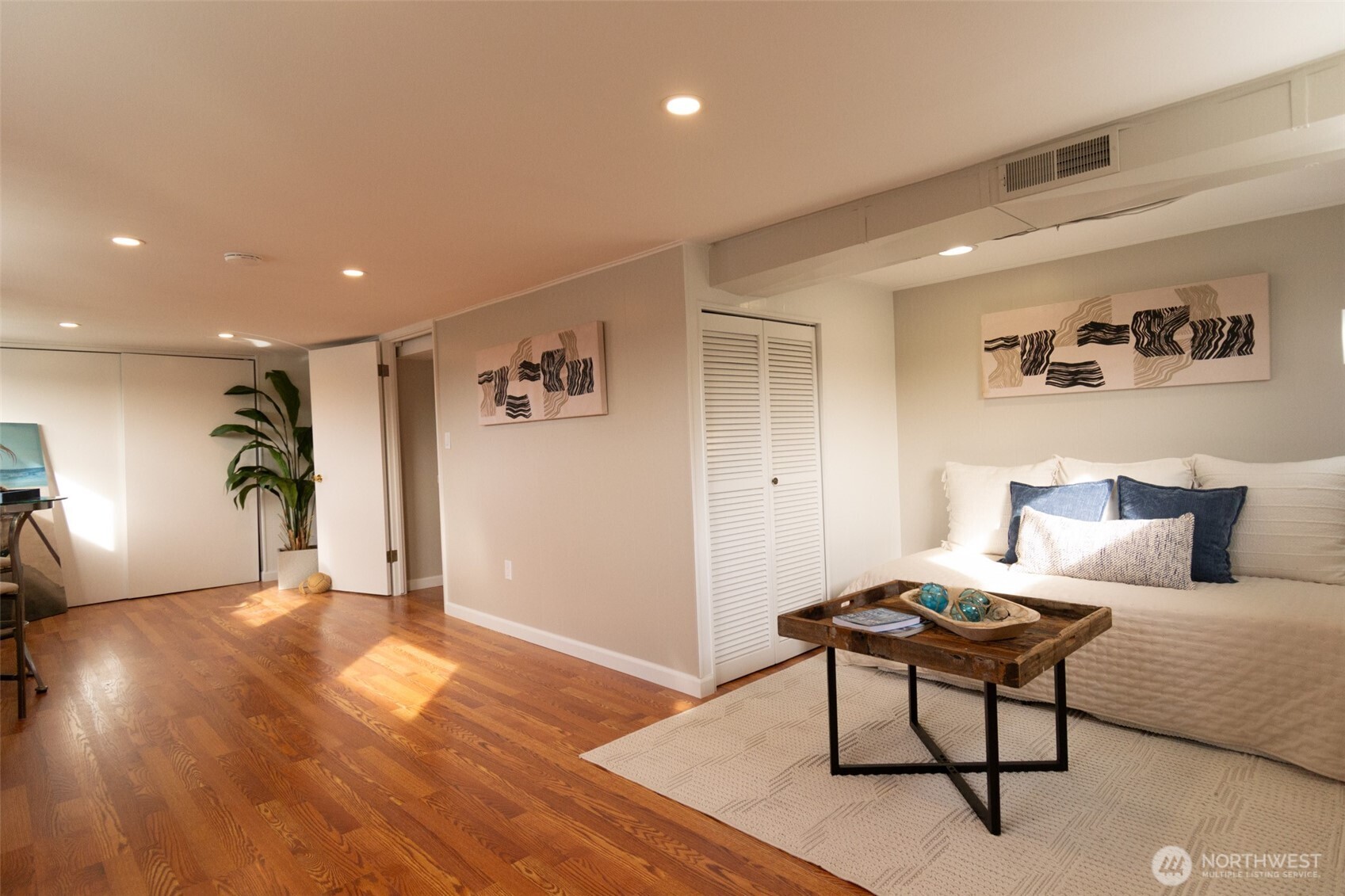 10826 Meadow Road Southwest Lakewood, WA 98499 - Photo 27 of 40 a living room with furniture and a wooden floor