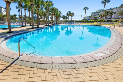 a view of swimming pool with outdoor seating