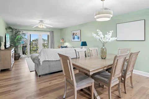a view of a dining room with furniture wooden floor and chandelier
