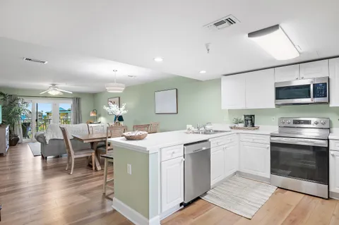 a kitchen with a sink and microwave