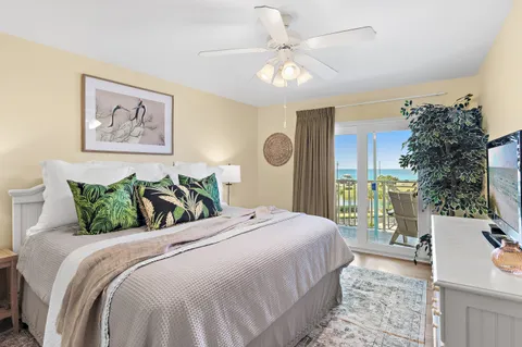 a bedroom with bed and wooden floor