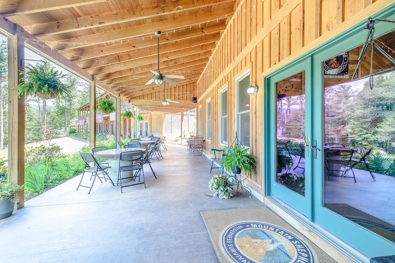 57 Hemlock Ridge Lane Catawba, VA 24070 - Photo 59 of 89 a view of a patio with a table and chairs and potted plants