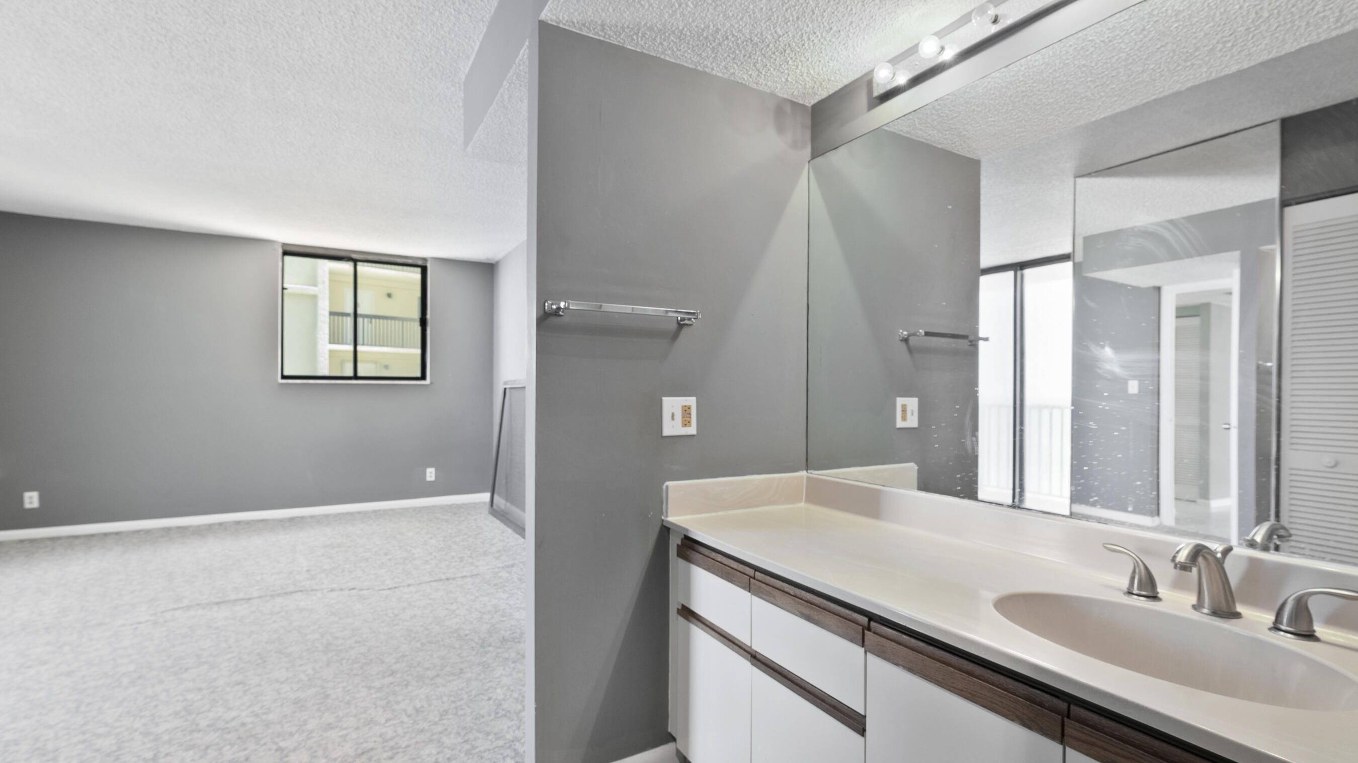 300 Ocean Trail Way, Unit 401 Jupiter, FL 33477 - Photo 13 of 41 a bathroom with a sink and a mirror