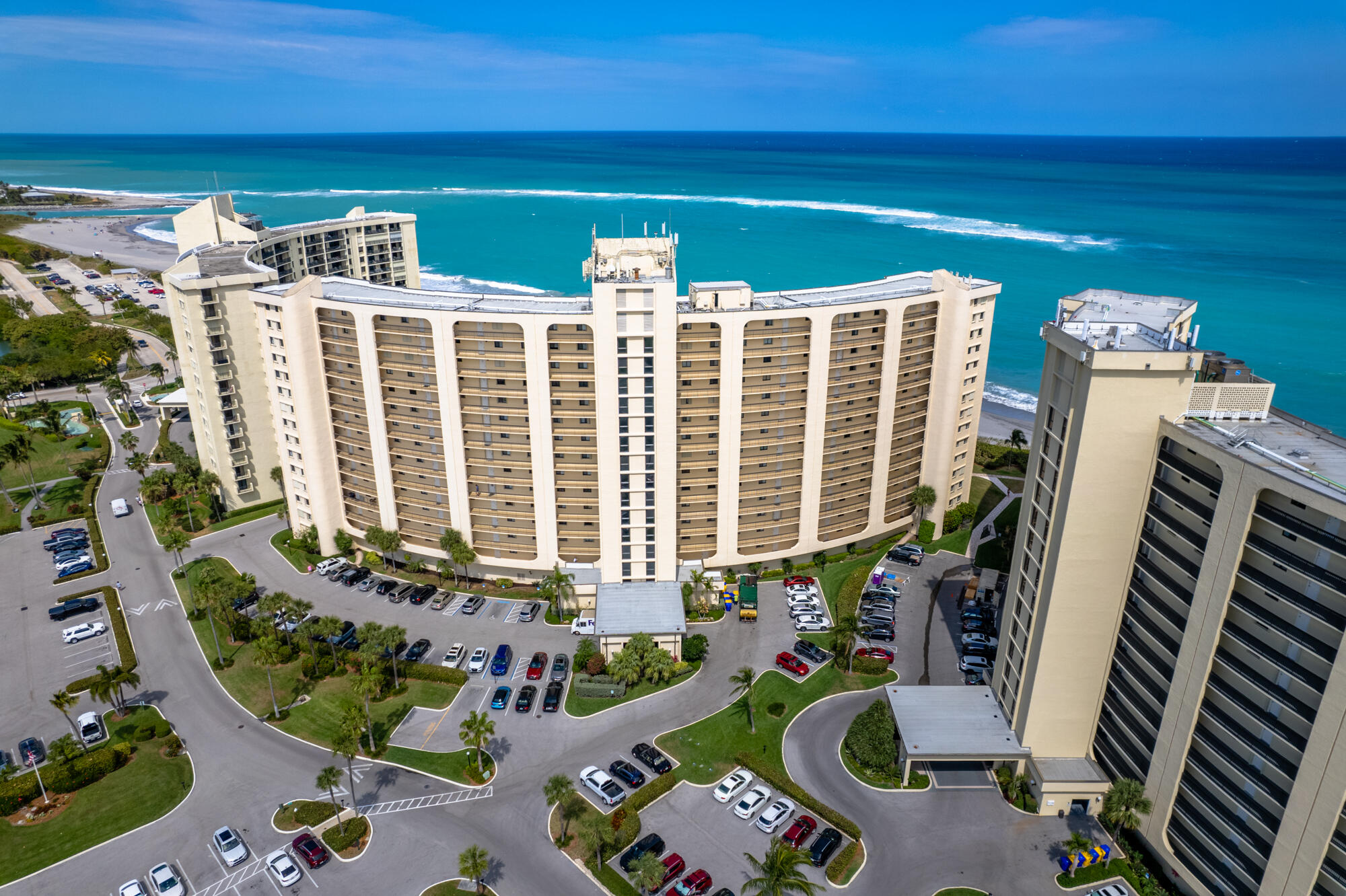 300 Ocean Trail Way, Unit 401 Jupiter, FL 33477 - Photo 2 of 41 a front view of a house with outdoor seating