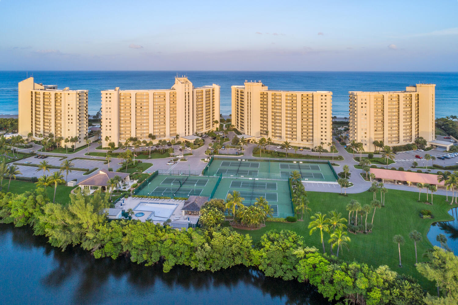 300 Ocean Trail Way, Unit 401 Jupiter, FL 33477 - Photo 22 of 41 a swimming pool with outdoor seating and plants