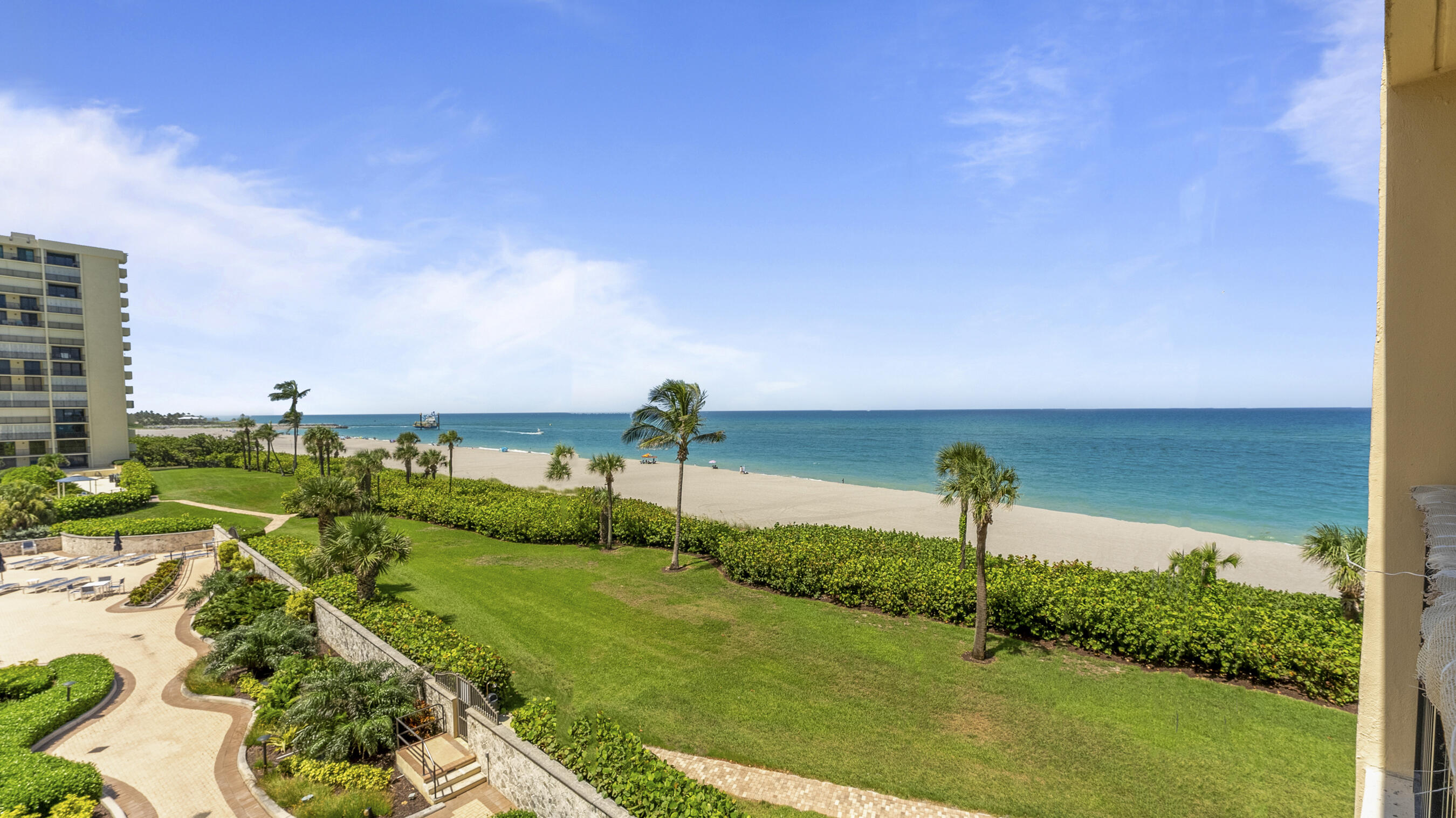 300 Ocean Trail Way, Unit 401 Jupiter, FL 33477 - Photo 29 of 41 a view of a garden with a lake