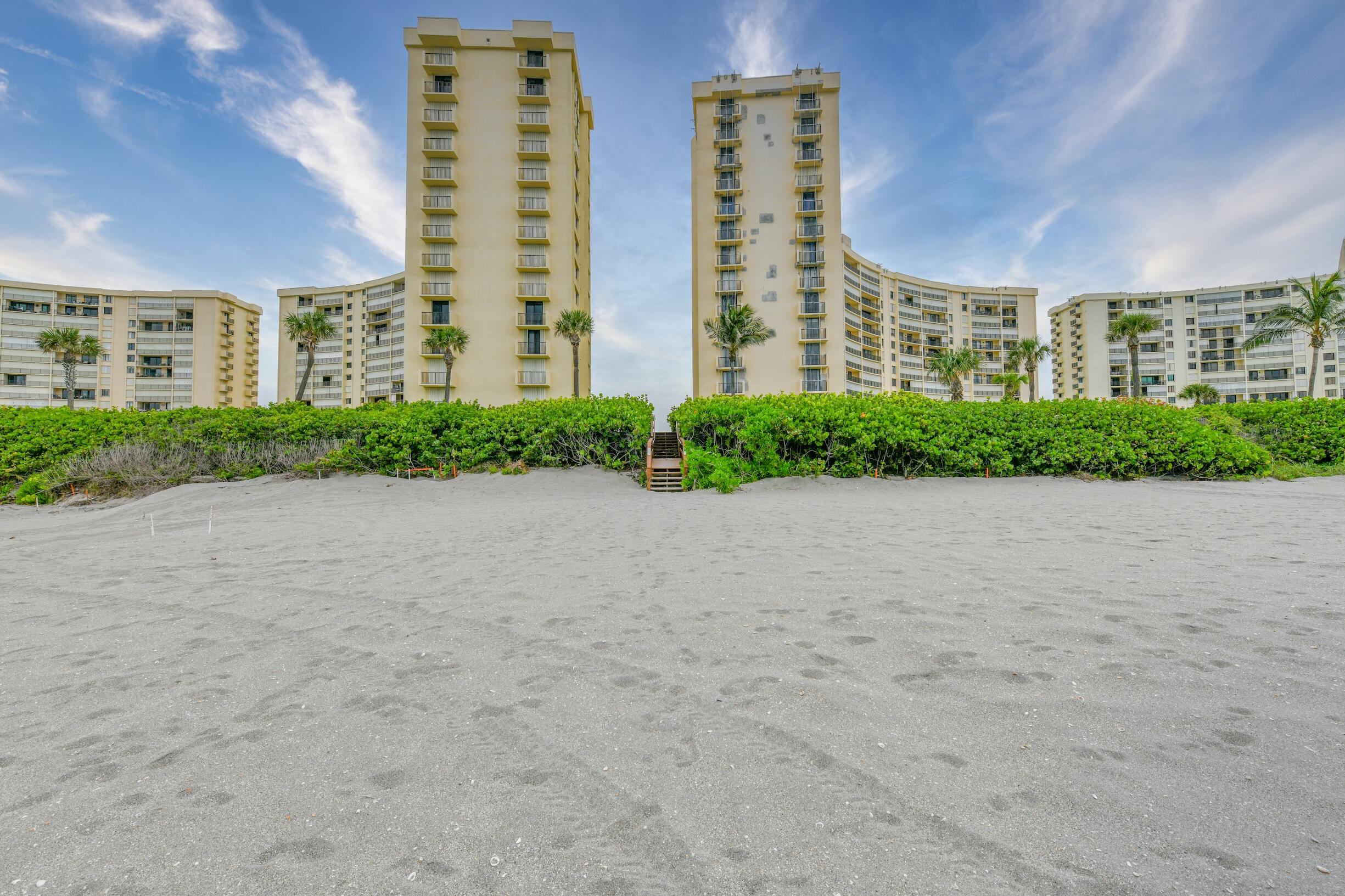300 Ocean Trail Way, Unit 401 Jupiter, FL 33477 - Photo 32 of 41 a view of an apartment with a yard