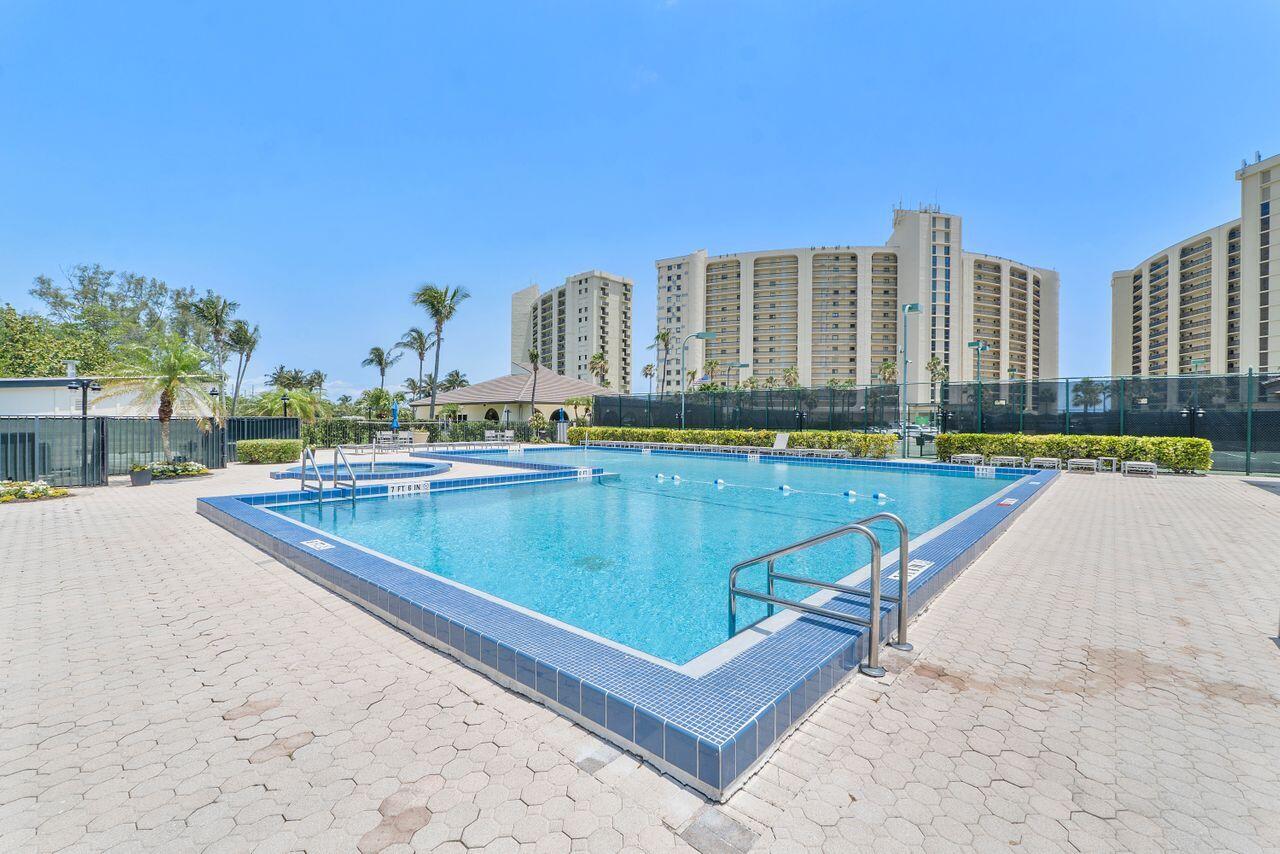 300 Ocean Trail Way, Unit 401 Jupiter, FL 33477 - Photo 37 of 41 a view of swimming pool with outdoor seating and city view