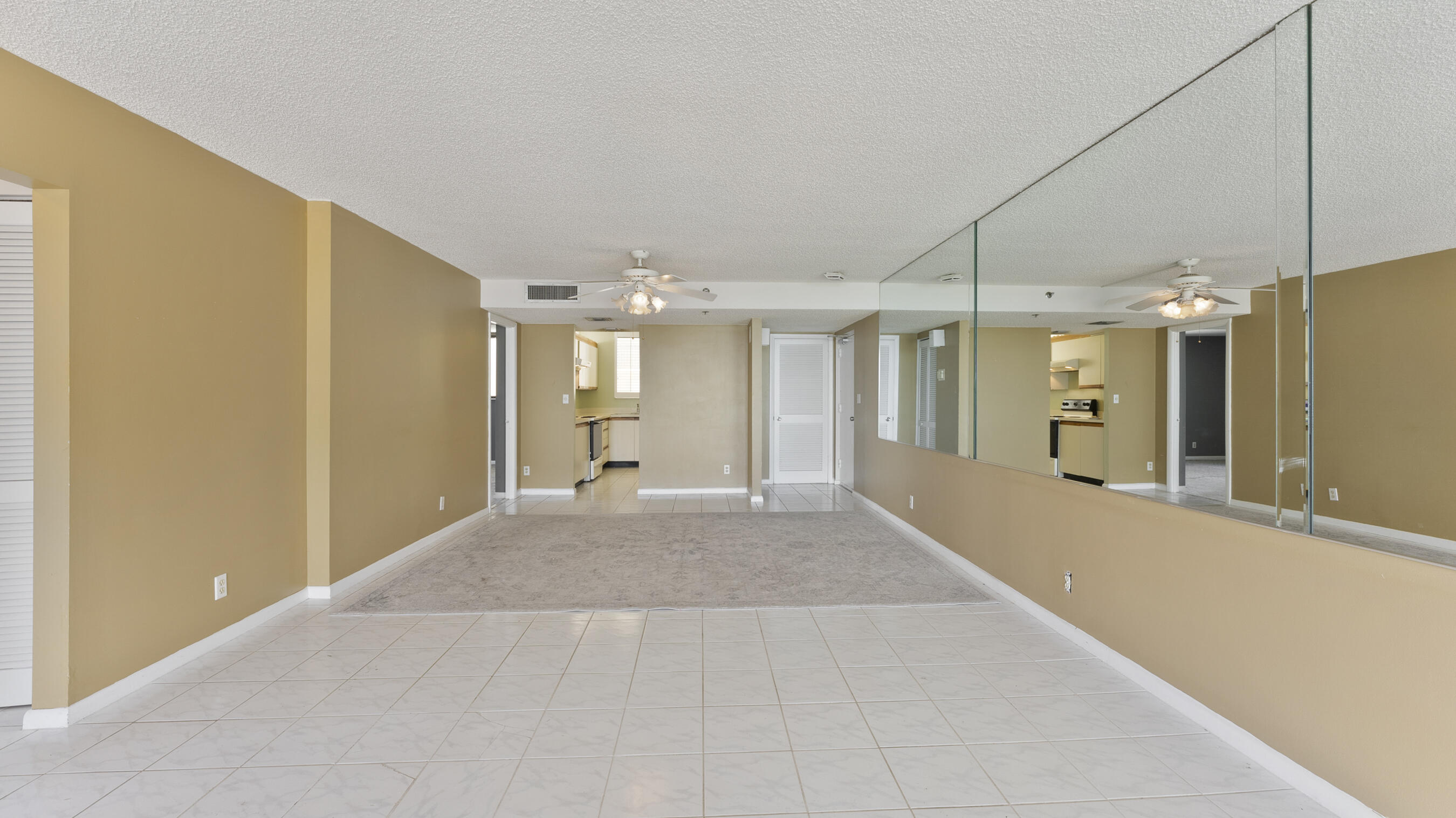 300 Ocean Trail Way, Unit 401 Jupiter, FL 33477 - Photo 6 of 41 a view of a big room with wooden floor and windows