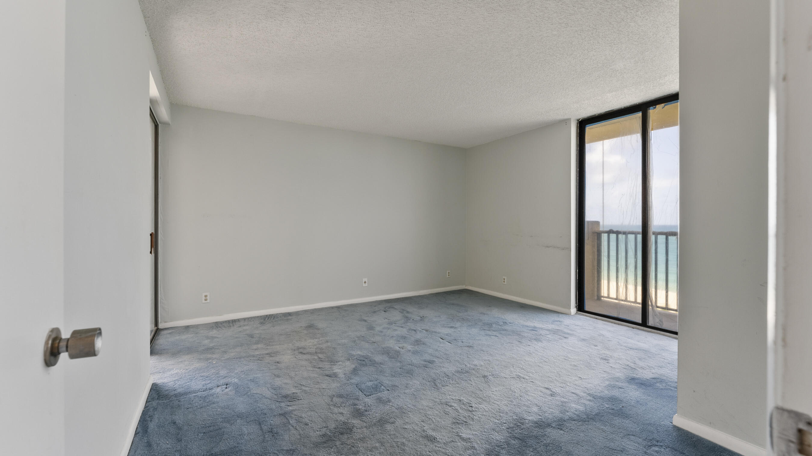 300 Ocean Trail Way, Unit 401 Jupiter, FL 33477 - Photo 8 of 41 an empty room with windows
