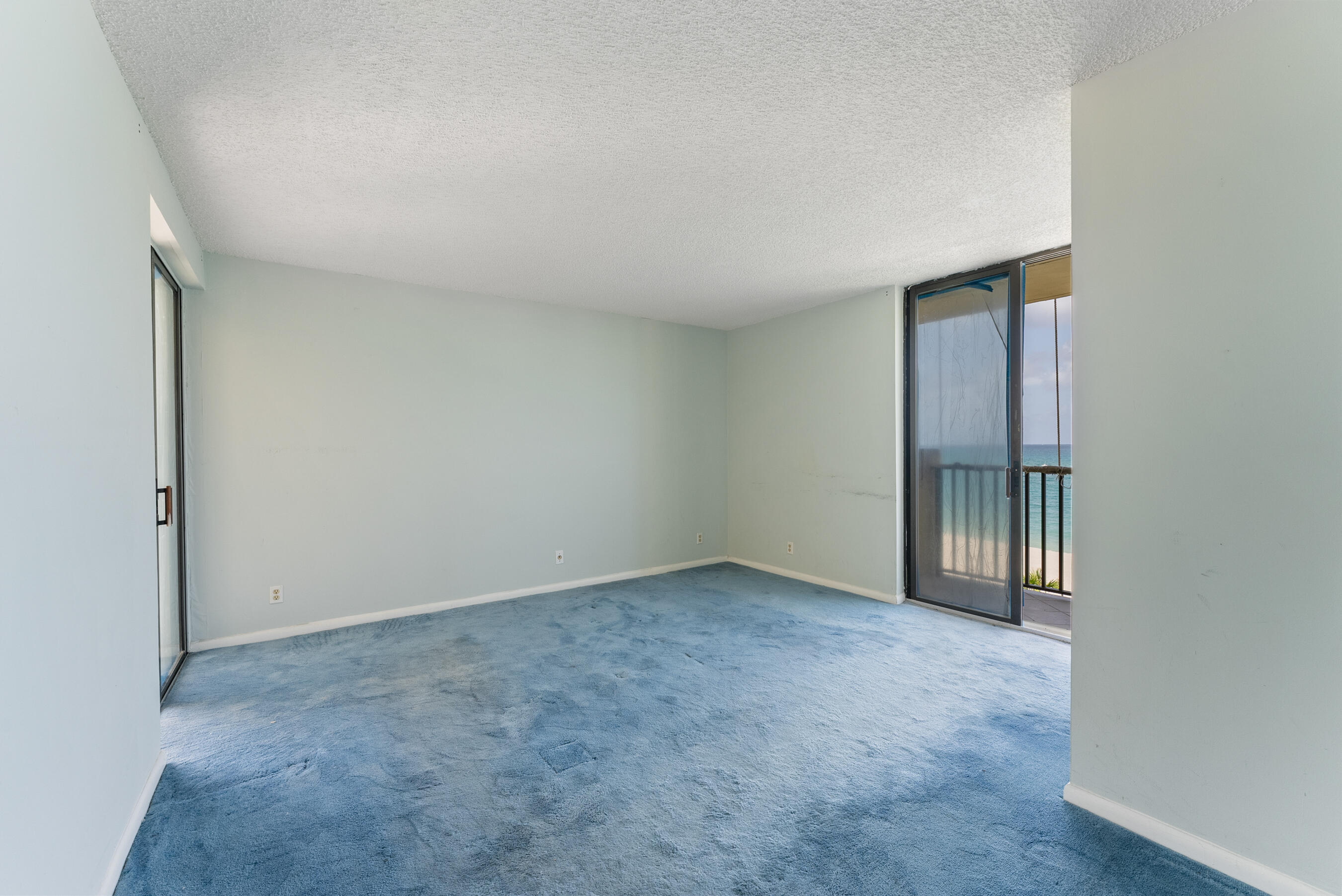 300 Ocean Trail Way, Unit 401 Jupiter, FL 33477 - Photo 9 of 41 an empty room with windows