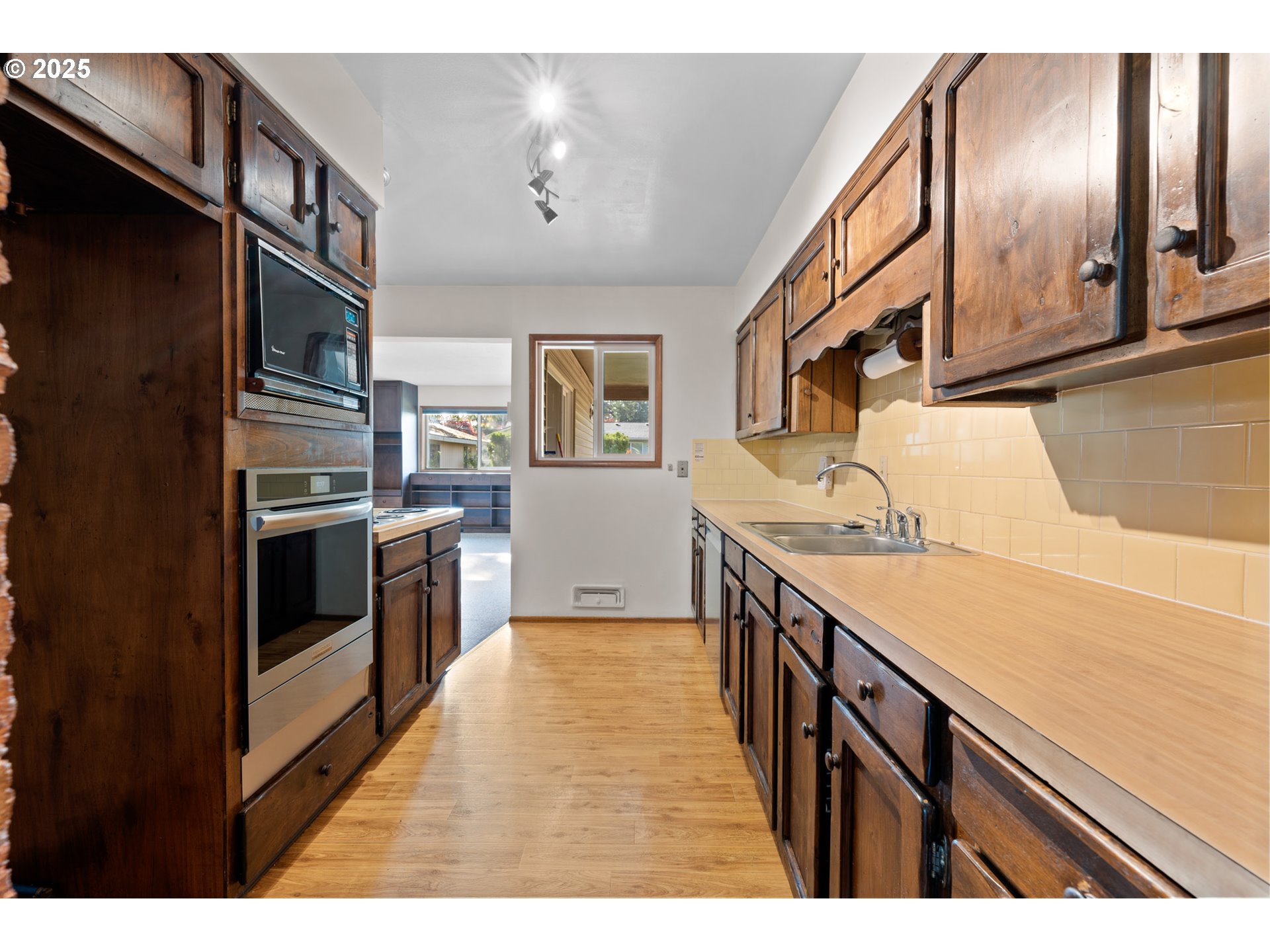 12342 Northeast Knott Street Portland, OR 97230 - Photo 13 of 40 a kitchen with stainless steel appliances granite countertop a refrigerator and a stove
