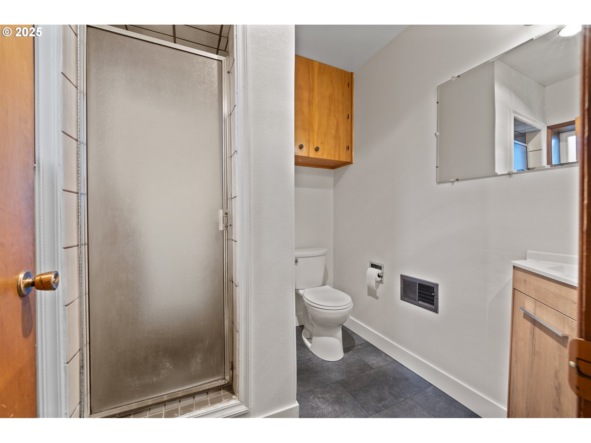 12342 Northeast Knott Street Portland, OR 97230 - Photo 20 of 40 a bathroom with a toilet and a shower