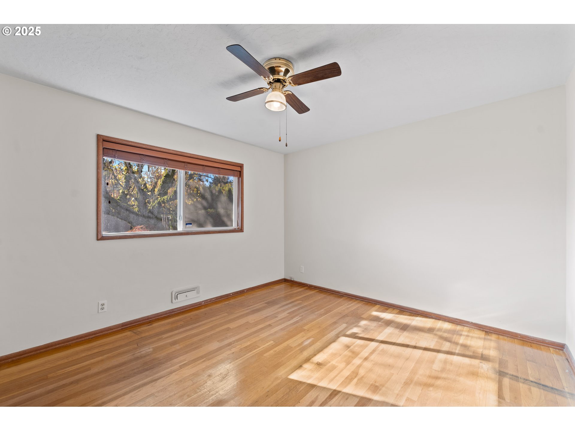 12342 Northeast Knott Street Portland, OR 97230 - Photo 8 of 40 a view of an empty room with a window